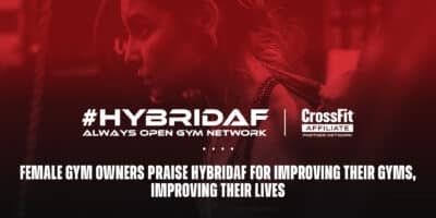Female gym owner standing confidently in her gym